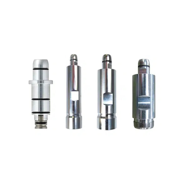 Four metallic cylindrical objects on a white background