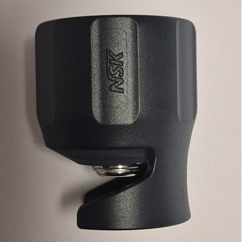 Black tool with 'NSK' branding on a beige background