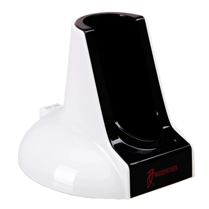 A black and white charging base for the Woodpecker LED-B Curing Light.